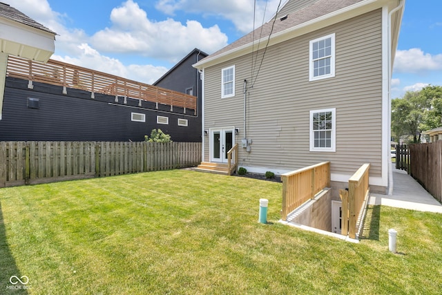 2031 Central Ave, Indianapolis, IN 46202 - rear view of house with french doors, a fenced backyard, and a shingled roof