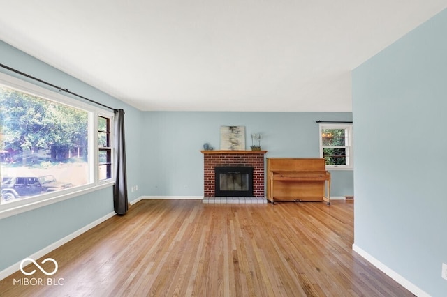 3630 E Morningside Dr, Bloomington, IN 47408 - unfurnished living room with wood finished floors and a fireplace