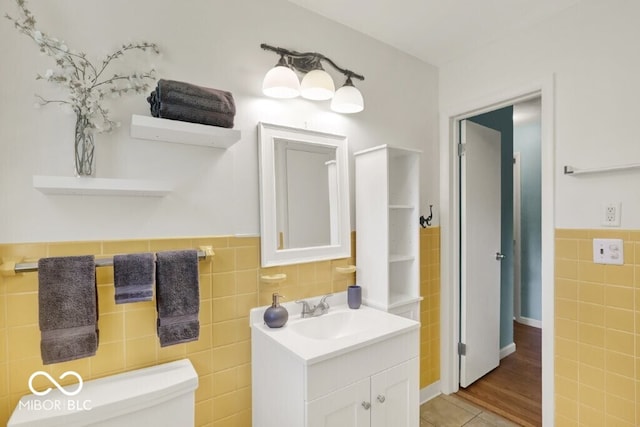 3630 E Morningside Dr, Bloomington, IN 47408 - bathroom with tile walls, vanity, and wainscoting