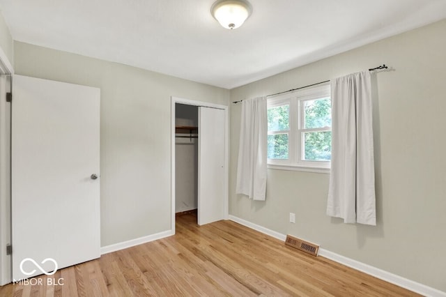 3630 E Morningside Dr, Bloomington, IN 47408 - unfurnished bedroom featuring light wood-type flooring and a closet