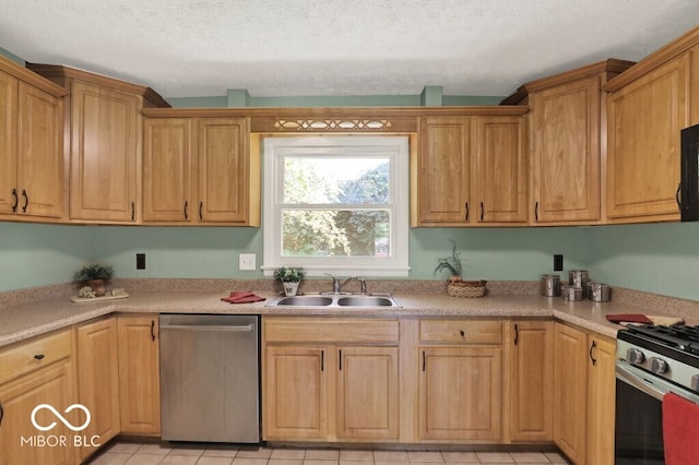 3630 E Morningside Dr, Bloomington, IN 47408 - kitchen with appliances with stainless steel finishes, light countertops, light tile patterned floors, and a textured ceiling