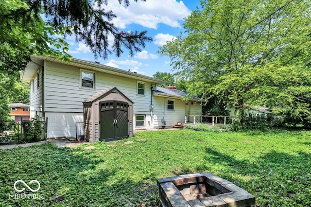 3630 E Morningside Dr, Bloomington, IN 47408 - rear view of house featuring a storage shed, an outdoor fire pit, and a chimney