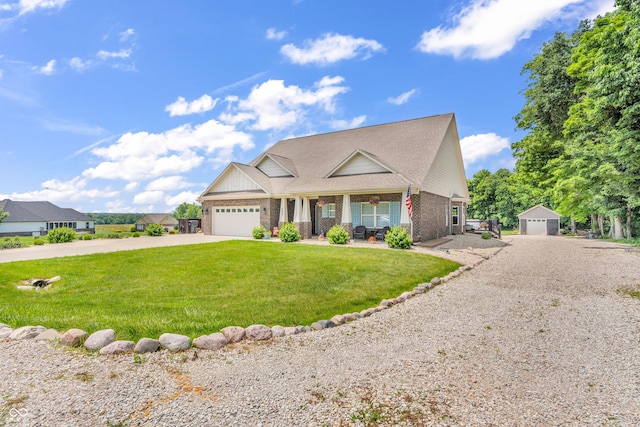 9231 E Poynter Dr, Morgantown, IN 46160 - view of front facade featuring driveway, a porch, a front lawn, brick siding, and a garage
