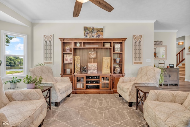 9231 E Poynter Dr, Morgantown, IN 46160 - living area with crown molding, ceiling fan, and stairs