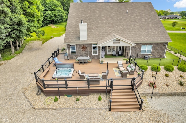 9231 E Poynter Dr, Morgantown, IN 46160 - rear view of house featuring an outdoor hangout area, brick siding, a chimney, and a fenced backyard