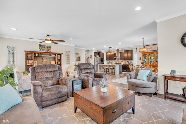 9231 E Poynter Dr, Morgantown, IN 46160 - living area with crown molding, recessed lighting, ceiling fan, and stairs