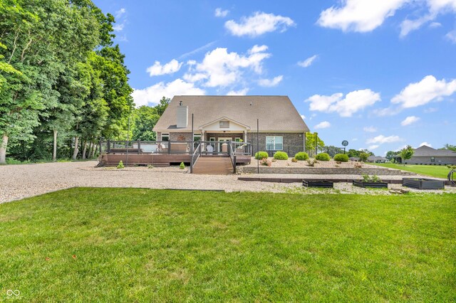 9231 E Poynter Dr, Morgantown, IN 46160 - rear view of house featuring a lawn and a wooden deck