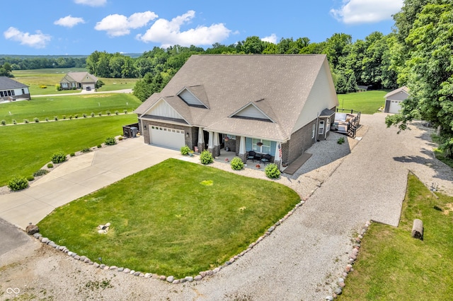 9231 E Poynter Dr, Morgantown, IN 46160 - view of front of home featuring driveway, an attached garage, a front yard, a shingled roof, and board and batten siding