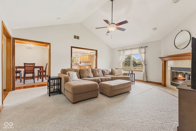 6629 Woodcrest Dr, Avon, IN 46123 - living room with a ceiling fan, a fireplace, light colored carpet, high vaulted ceiling, and a chandelier