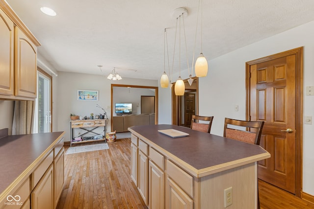 6629 Woodcrest Dr, Avon, IN 46123 - kitchen with light brown cabinetry, dark countertops, and light wood finished floors