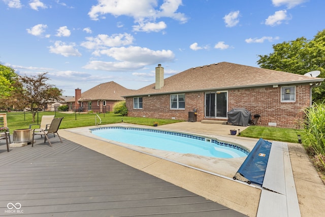 6629 Woodcrest Dr, Avon, IN 46123 - outdoor pool featuring a wooden deck, an outdoor fire pit, and area for grilling