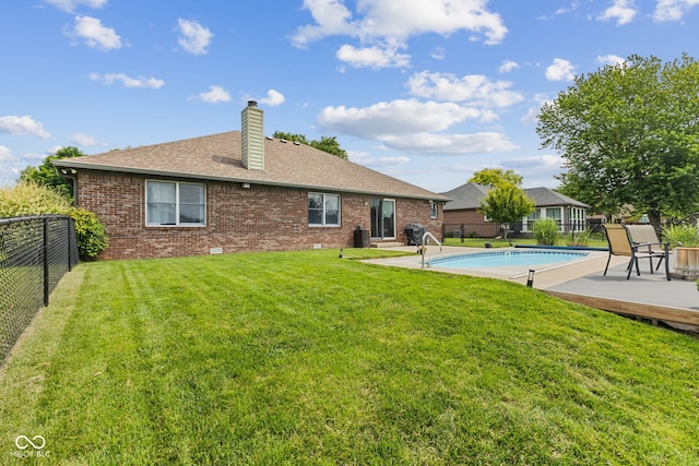 6629 Woodcrest Dr, Avon, IN 46123 - back of property featuring a fenced backyard, a chimney, brick siding, and roof with shingles