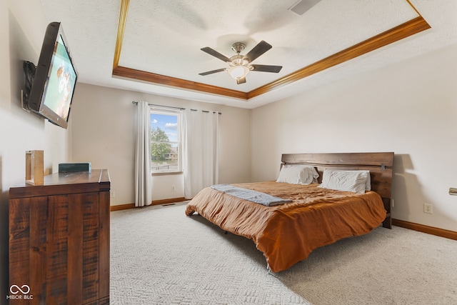 6629 Woodcrest Dr, Avon, IN 46123 - carpeted bedroom with a tray ceiling, ceiling fan, ornamental molding, and a textured ceiling