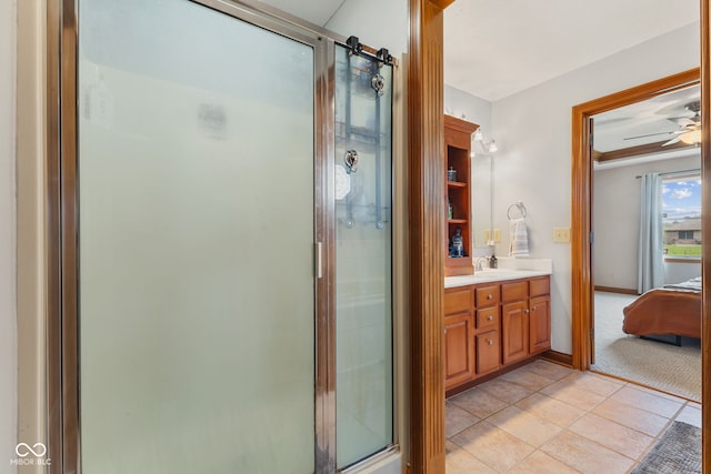 6629 Woodcrest Dr, Avon, IN 46123 - full bath with vanity, a shower stall, ensuite bathroom, tile patterned flooring, and ceiling fan