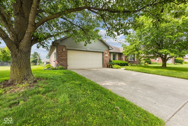 6629 Woodcrest Dr, Avon, IN 46123 - view of front facade with a garage, brick siding, concrete driveway, and a front lawn