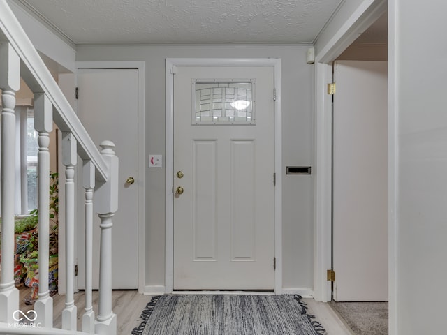 1532 E Markwood Ave, Indianapolis, IN 46227 - foyer featuring a textured ceiling and baseboards
