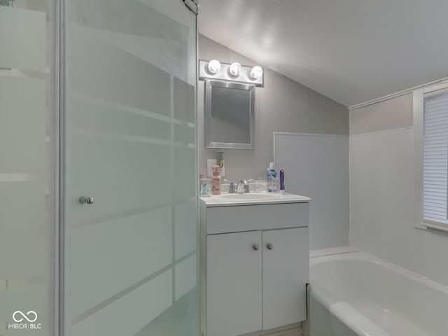 1532 E Markwood Ave, Indianapolis, IN 46227 - full bathroom featuring vaulted ceiling, vanity, and a garden tub