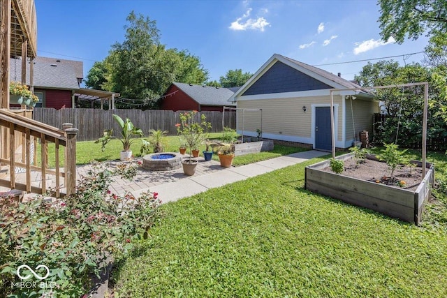 2325 N Talbott St, Indianapolis, IN 46205 - view of yard featuring a vegetable garden and a patio