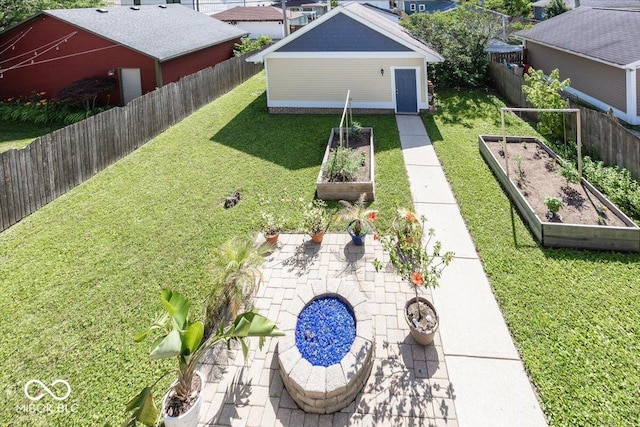 2325 N Talbott St, Indianapolis, IN 46205 - fenced backyard with a vegetable garden and an outdoor structure