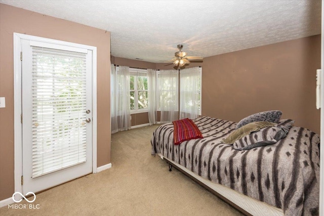 2325 N Talbott St, Indianapolis, IN 46205 - bedroom with light carpet, a textured ceiling, and ceiling fan
