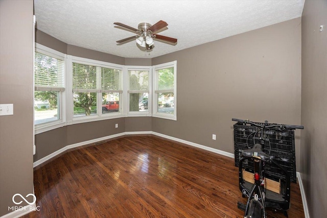 2325 N Talbott St, Indianapolis, IN 46205 - spare room featuring ceiling fan, wood finished floors, and a textured ceiling