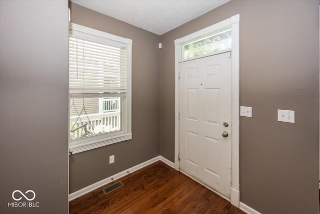 2325 N Talbott St, Indianapolis, IN 46205 - entrance foyer with baseboards and dark wood-type flooring