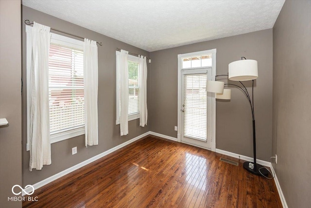 2325 N Talbott St, Indianapolis, IN 46205 - empty room with hardwood / wood-style flooring and a textured ceiling