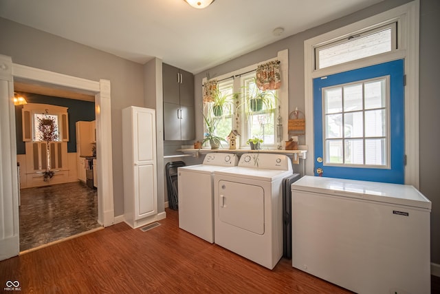 426 N Franklin St, Greensburg, IN 47240 - laundry area with washing machine and clothes dryer, wood finished floors, and plenty of natural light