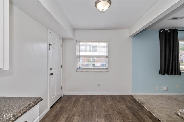 10016 Penrith Dr, Indianapolis, IN 46229 - empty room featuring dark wood finished floors and plenty of natural light