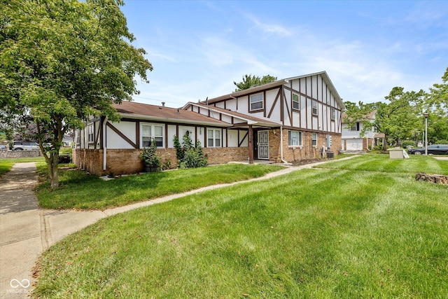 10016 Penrith Dr, Indianapolis, IN 46229 - tudor house with brick siding and a front yard