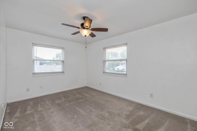10016 Penrith Dr, Indianapolis, IN 46229 - carpeted empty room with plenty of natural light and a ceiling fan