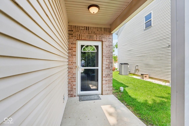 1138 Topp Creek Dr, Indianapolis, IN 46214 - doorway to property featuring brick siding and a yard
