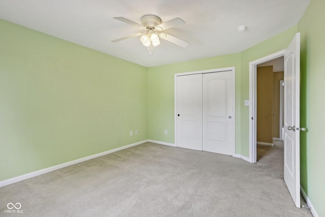 1138 Topp Creek Dr, Indianapolis, IN 46214 - unfurnished bedroom with carpet flooring, a closet, and a ceiling fan