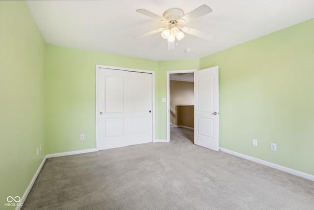1138 Topp Creek Dr, Indianapolis, IN 46214 - unfurnished bedroom with carpet floors, a closet, and a ceiling fan