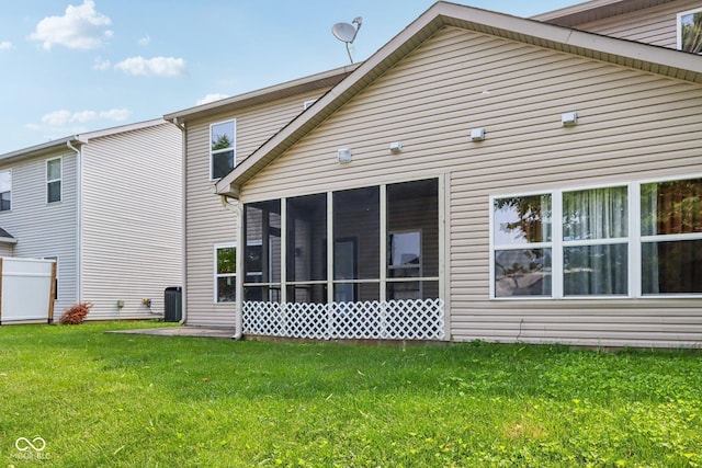 1138 Topp Creek Dr, Indianapolis, IN 46214 - back of property featuring a sunroom and a lawn