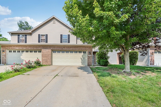 1138 Topp Creek Dr, Indianapolis, IN 46214 - view of front of home featuring brick siding, driveway, and a garage