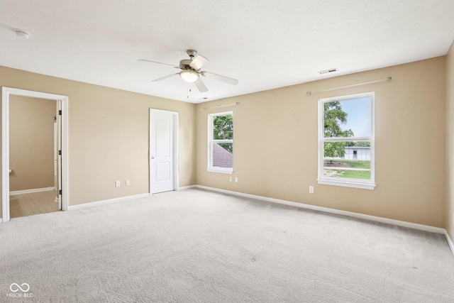 1138 Topp Creek Dr, Indianapolis, IN 46214 - unfurnished bedroom with light colored carpet and ceiling fan