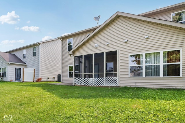 1138 Topp Creek Dr, Indianapolis, IN 46214 - rear view of house with a yard and a sunroom