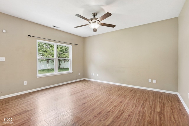 1138 Topp Creek Dr, Indianapolis, IN 46214 - spare room featuring wood finished floors and ceiling fan