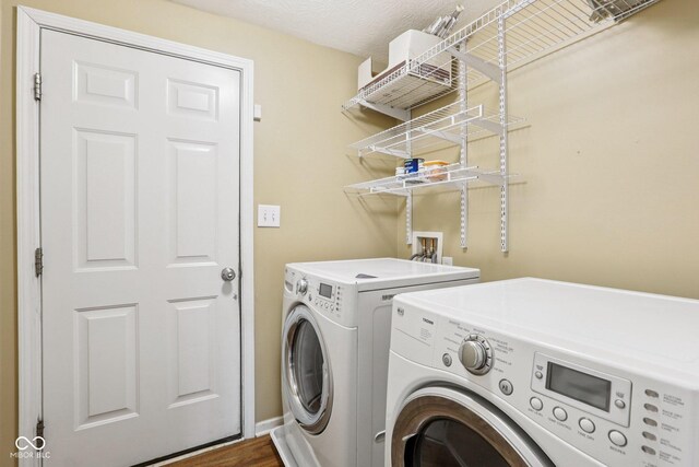 1138 Topp Creek Dr, Indianapolis, IN 46214 - laundry area featuring separate washer and dryer and wood finished floors