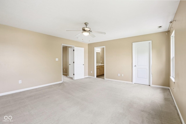 1138 Topp Creek Dr, Indianapolis, IN 46214 - unfurnished bedroom with light carpet, ensuite bath, and ceiling fan