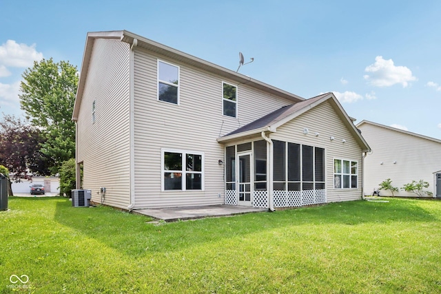 1138 Topp Creek Dr, Indianapolis, IN 46214 - back of house with a sunroom, a lawn, and a patio area