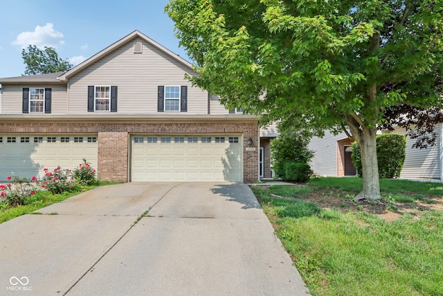 1138 Topp Creek Dr, Indianapolis, IN 46214 - view of front of property featuring brick siding, driveway, and an attached garage