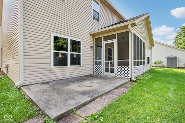 1138 Topp Creek Dr, Indianapolis, IN 46214 - back of house with a sunroom, a patio, a lawn, and an outbuilding