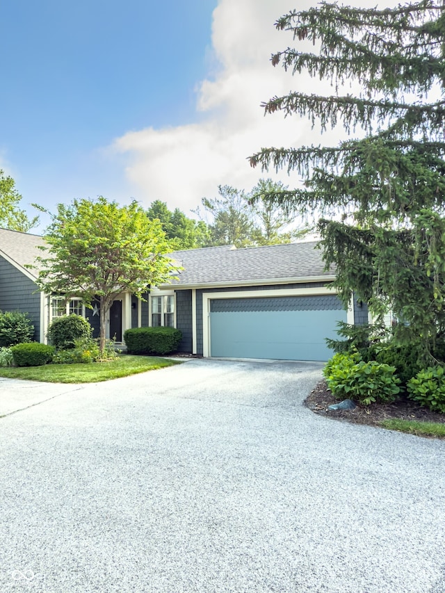 7470 Charrington Ct, Indianapolis, IN 46254 - single story home with asphalt driveway, a garage, and roof with shingles