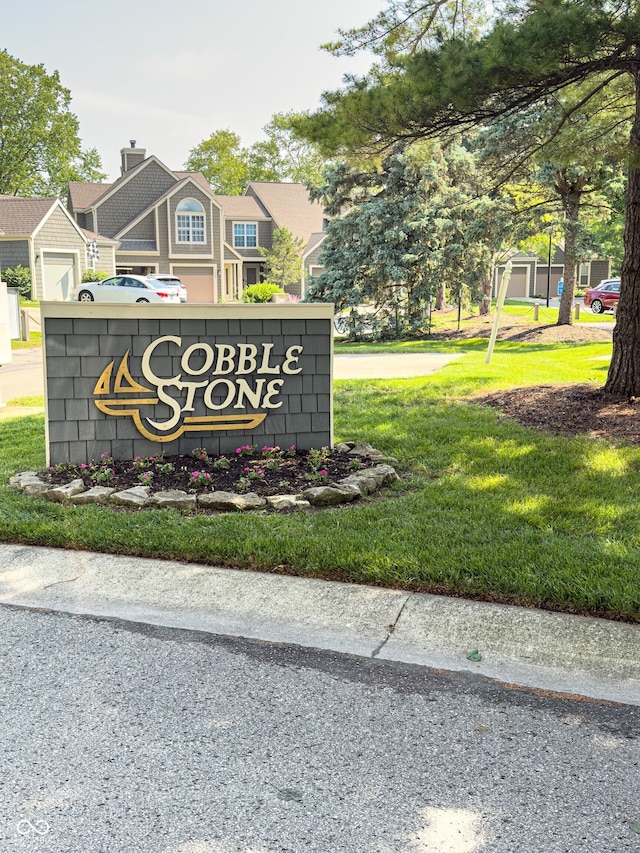 7470 Charrington Ct, Indianapolis, IN 46254 - community sign featuring a yard and a residential view