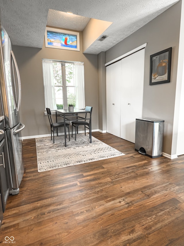 7470 Charrington Ct, Indianapolis, IN 46254 - dining area with a textured ceiling and dark wood-style flooring
