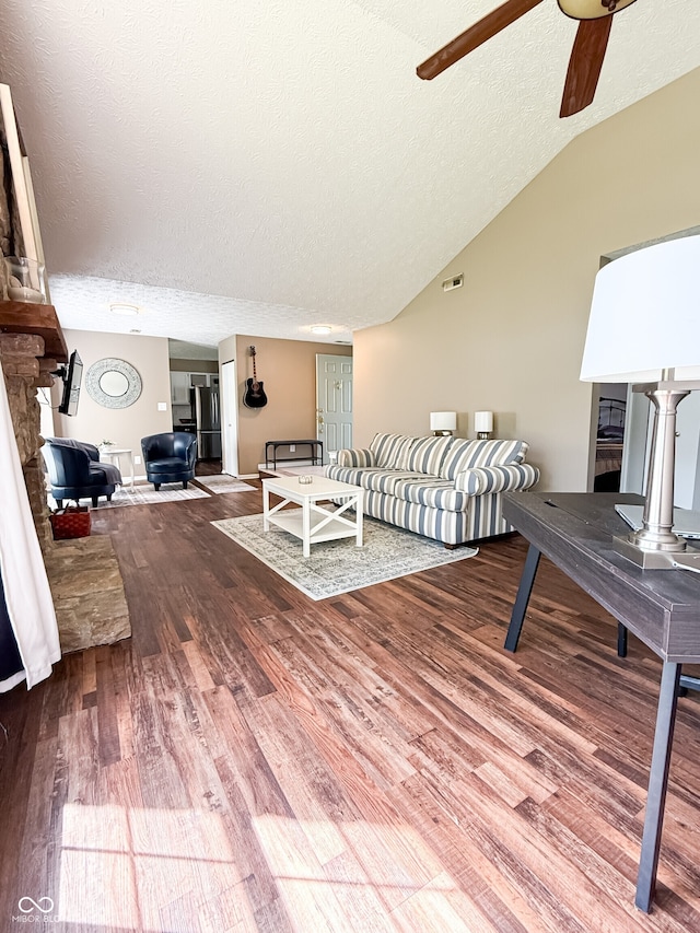 7470 Charrington Ct, Indianapolis, IN 46254 - bedroom featuring wood finished floors, a textured ceiling, and lofted ceiling