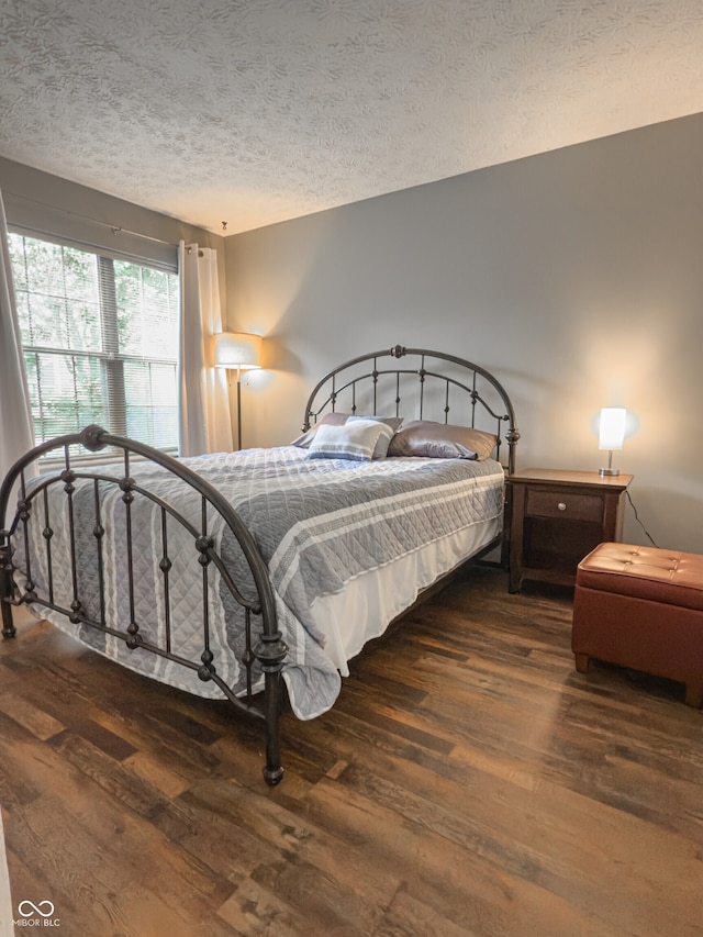 7470 Charrington Ct, Indianapolis, IN 46254 - bedroom featuring wood finished floors and a textured ceiling