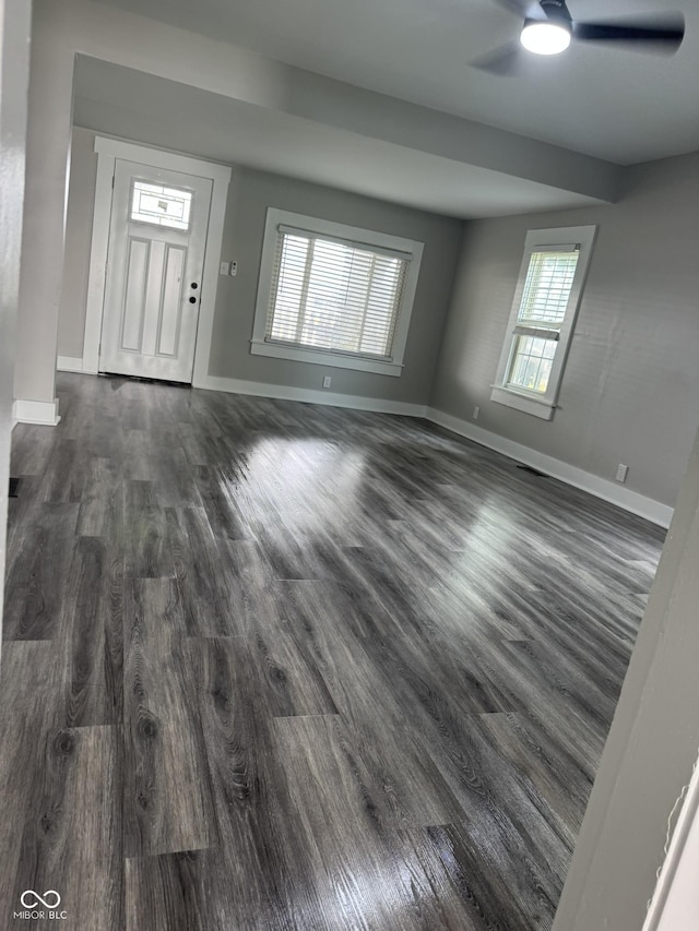 1006 Hurricane St, Franklin, IN 46131 - unfurnished living room featuring a ceiling fan and dark wood-style floors